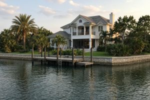 Intracoastal house with a small dock along the seawall — ai training in Belleair Beach